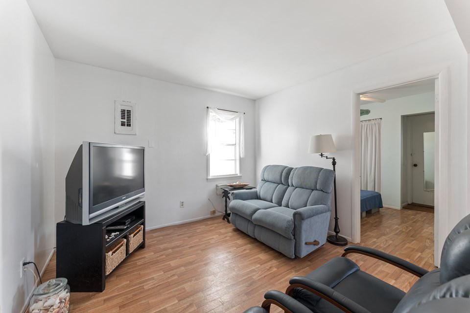 the open doorway to your right leads to the second bedroom and the garage
