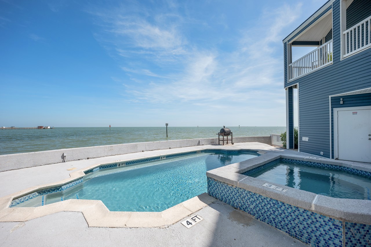 common area with pool, hot tub, b-b-q area and what a view