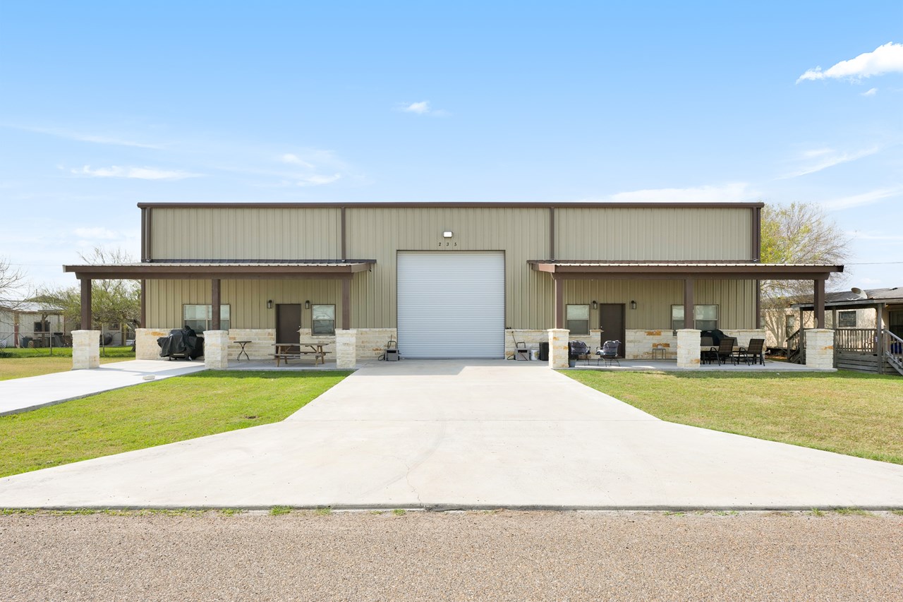 each unit has it's own covered bar-b-q area the garage is only accessible by a doorway into the unit on your right.  again, at the back of this garage is a small utility room for storage and houses the washer and dryer for this unit.