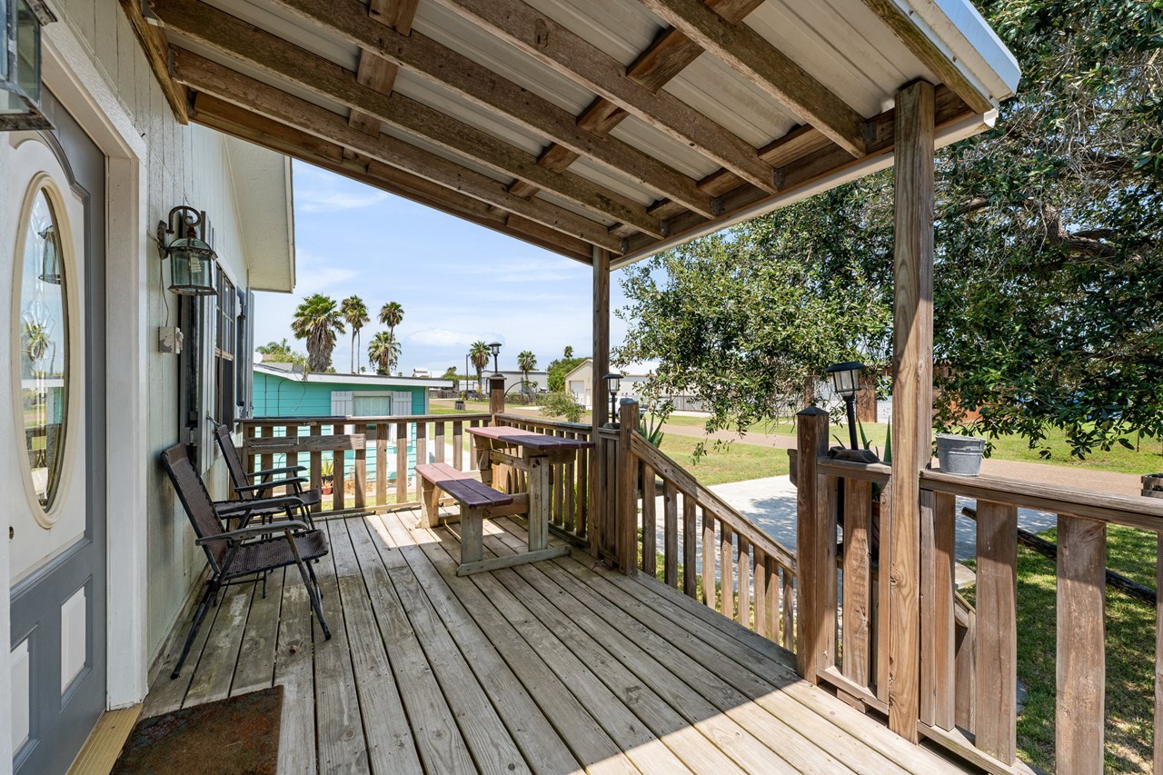 covered front deck which faces east