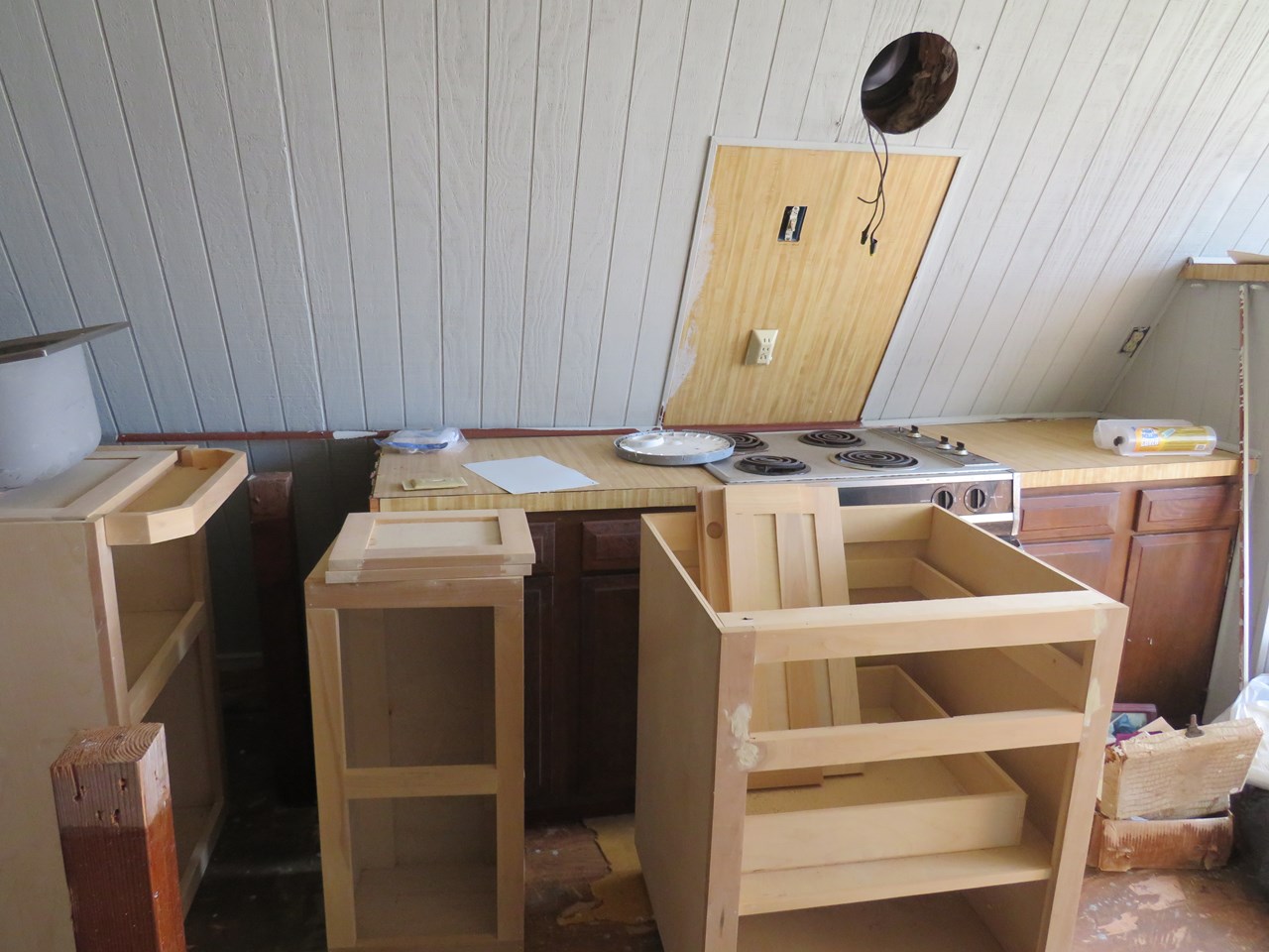 cabinets and stove in kitchen area
