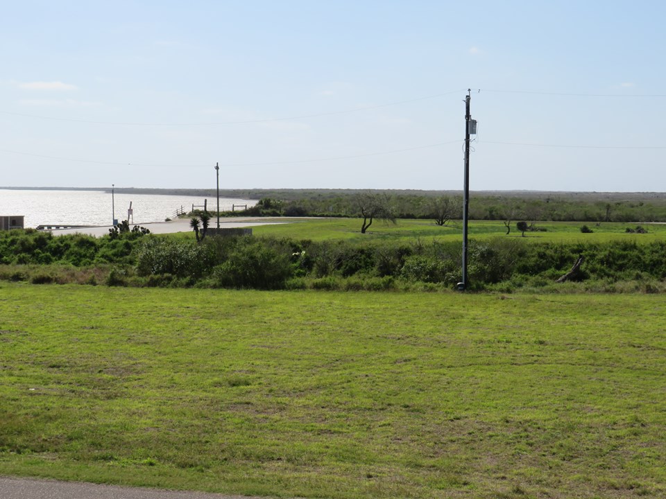 this vacant lot has 94' of frontage on port south dr the lot is 145' deep on the west end and is 143.83 feet deep on the east side.  according to the willacy county appraisal district , this lot has 0.2819 acres of land.