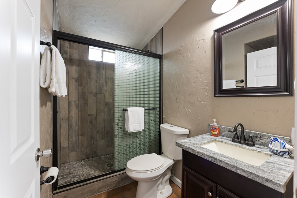 full bath upstairs has been recently remodeled with custom shower and new vanity