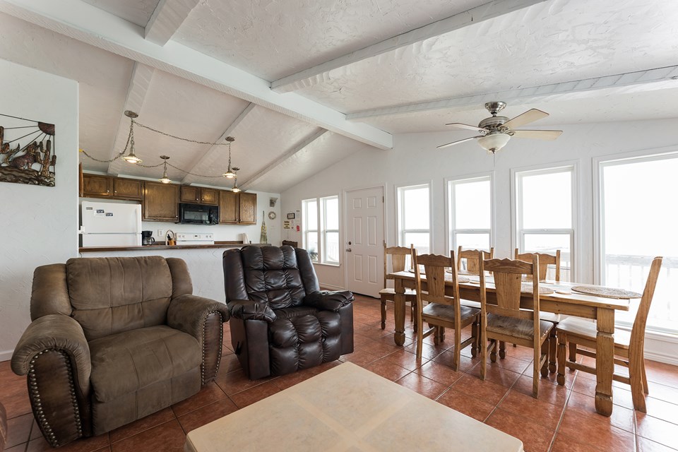 open living, dining, kitchen with vaulted ceiling--fantastic view of bay from upstairs