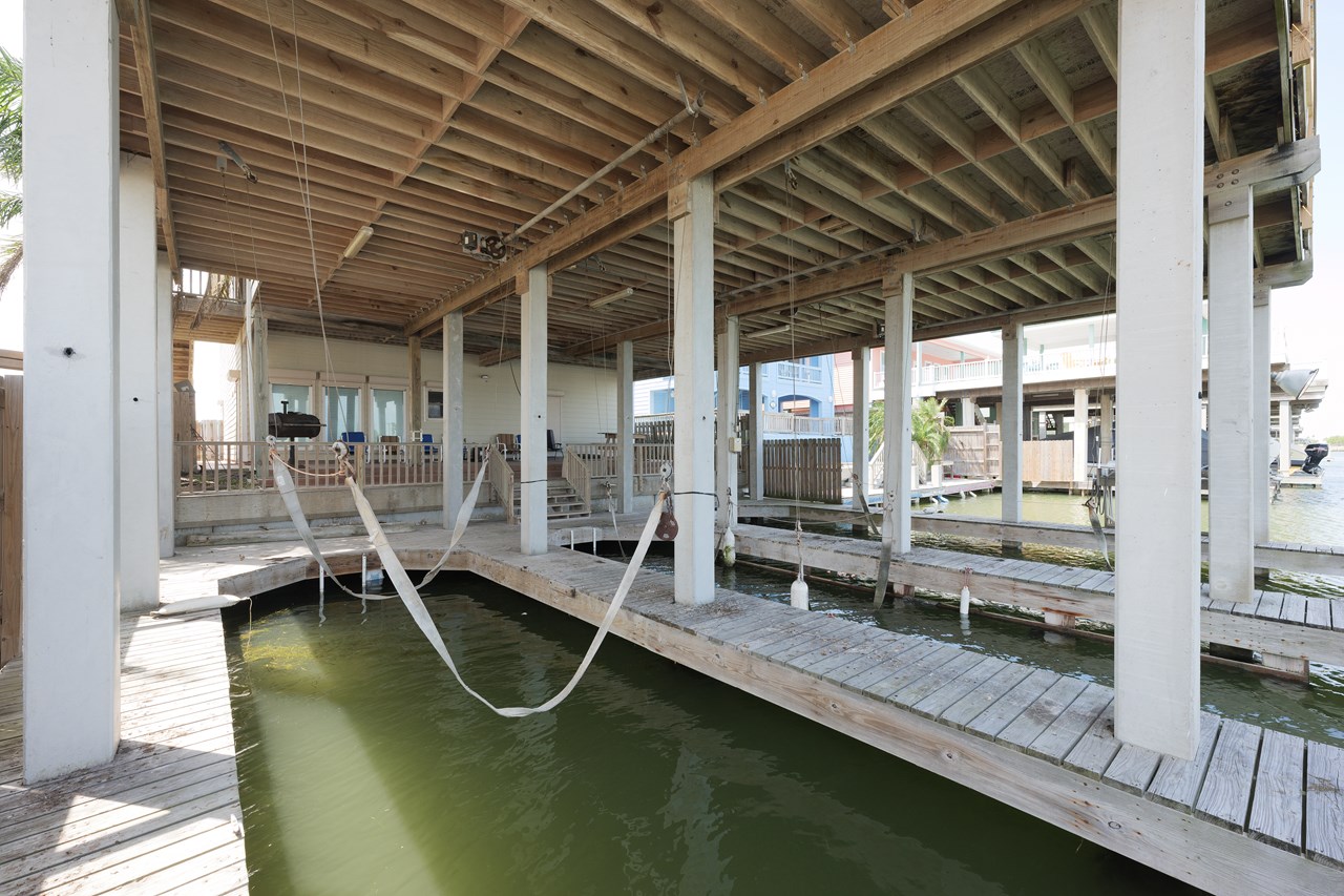three covered boat slips with electric lifts