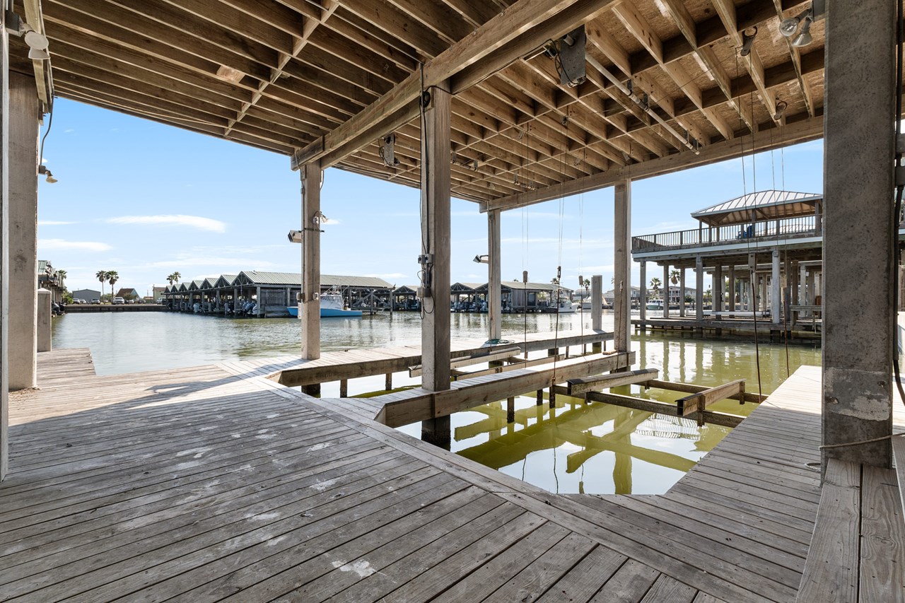 two covered boat slips with lifts
